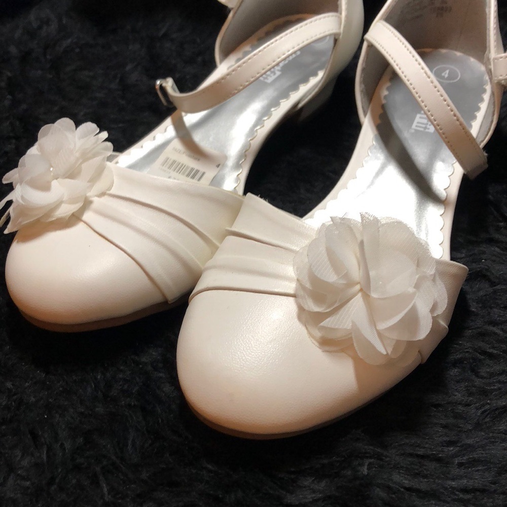 Kids’ white heels.